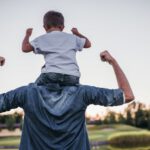 dad son on shoulders strong