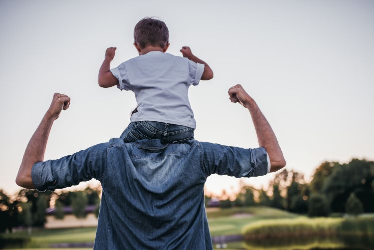 dad son on shoulders strong