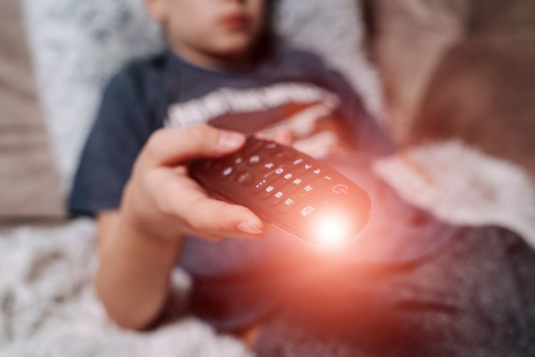 kids watching tv news remote control