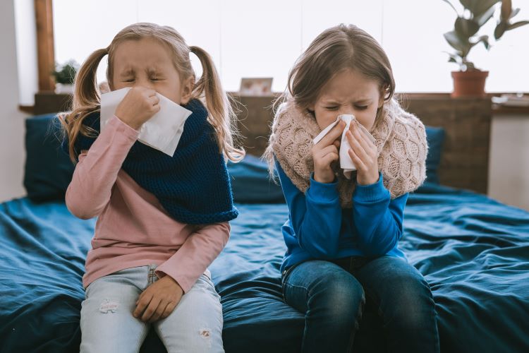 sick children sneezing tissues blow nose