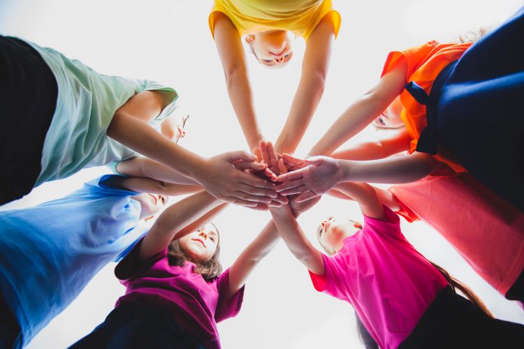 selflessness teamwork generosity hands in