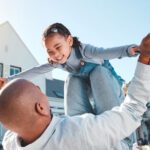 time flies dad lifts girl play daughter