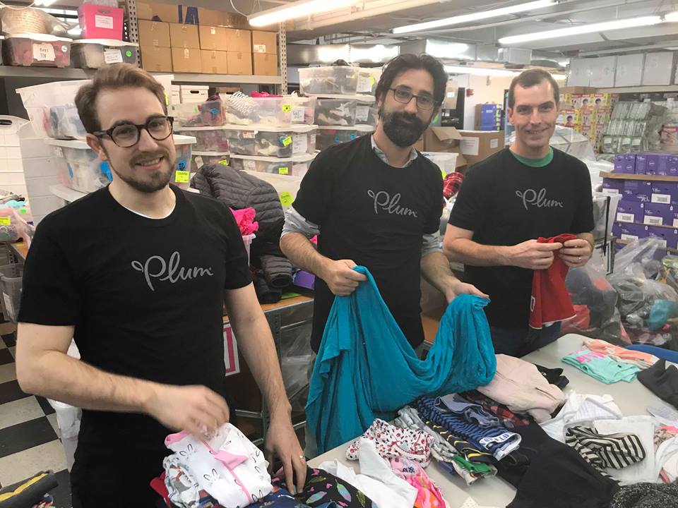 NYC Dads Group folding and sorting clothes for GOOD+ Foundation for Giving Tuesday 2017.