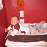 baby on changing table