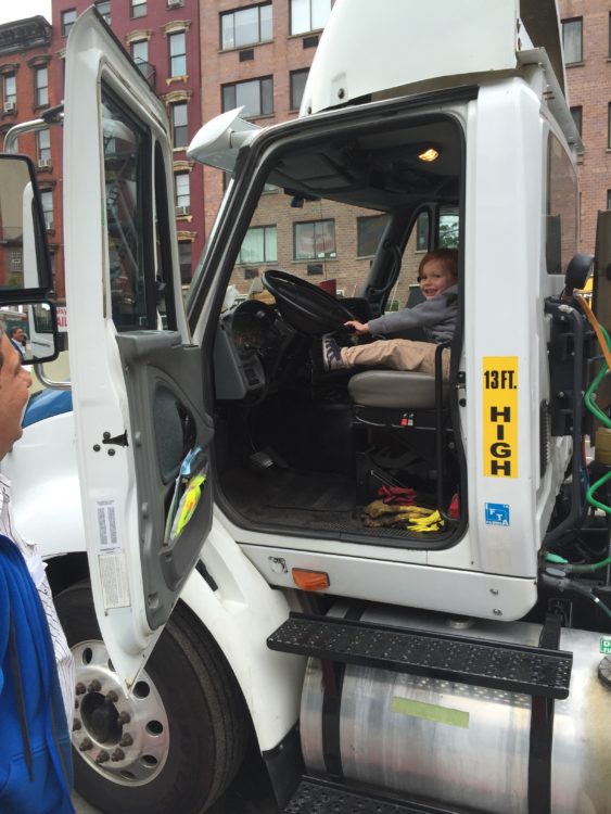 boy driving tractor trailer
