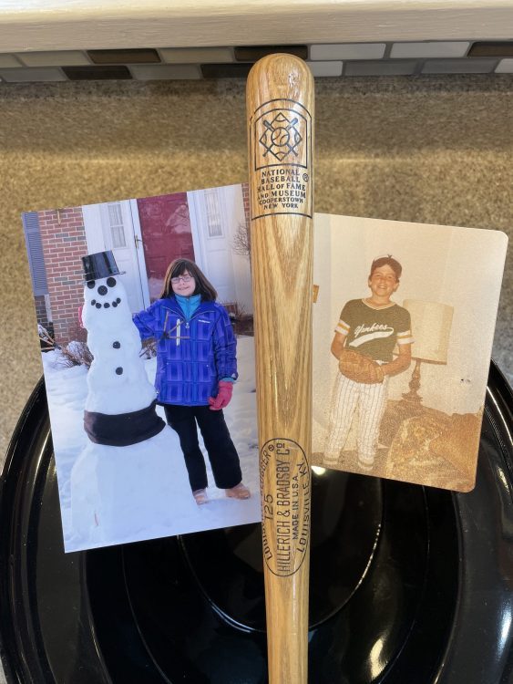 family heirlooms photos, miniature baseball bat, snowman's top hat