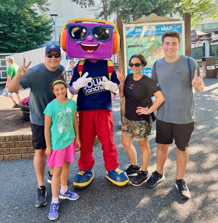 Jolly Rancher character poses with Somerfeld family