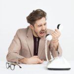 man screams in phone call