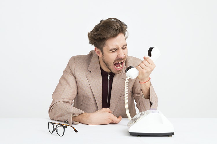 man screams in phone call