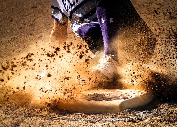 baseball softball player slides into base sports