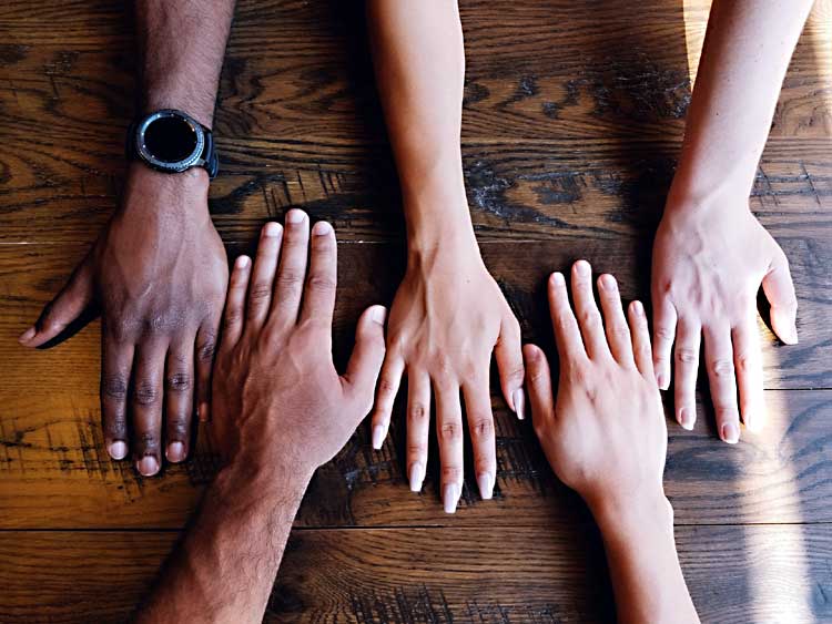 blending families hands on table different colors