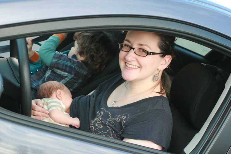 breastfeeding mom in a car