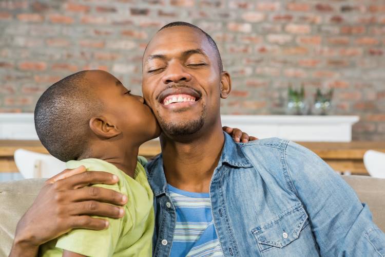 celebrate black dads son kisses father