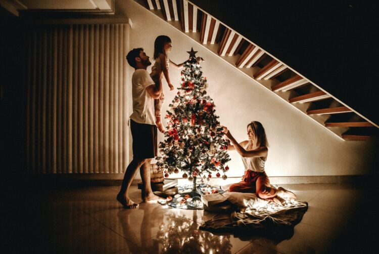 christmas tradition family decorating tree