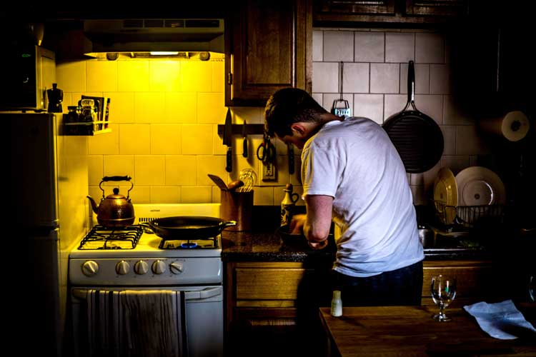 dad in kitchen cooking at stove