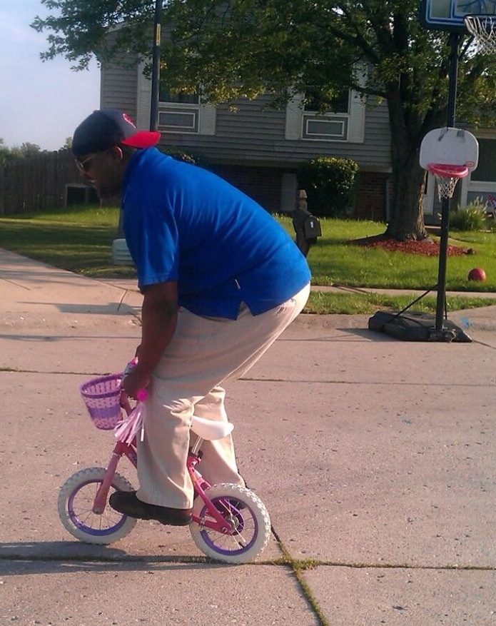 Dad on child's bike