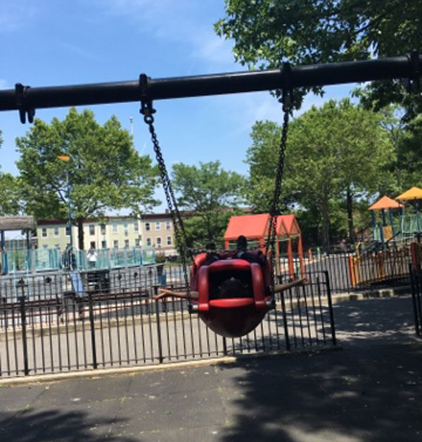Dry Harbor Playground airplane swing