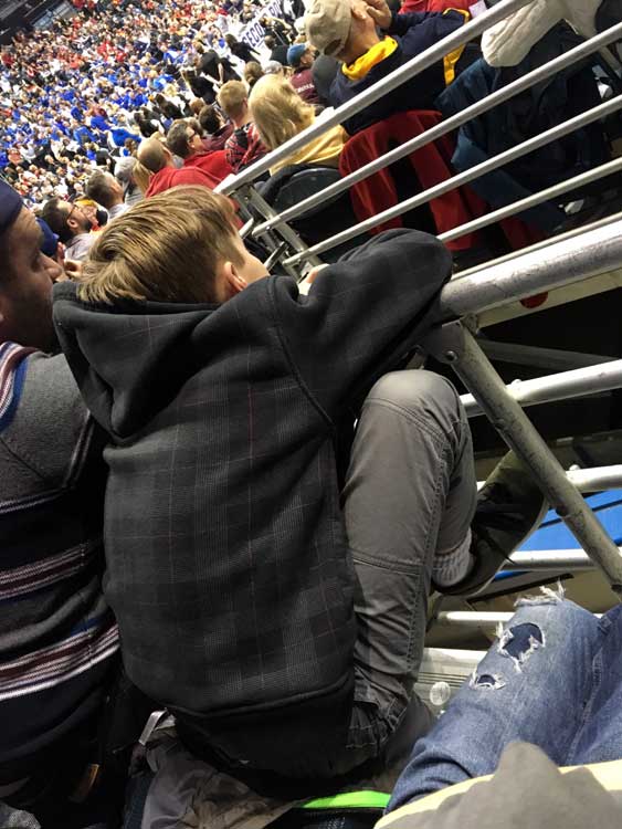 The son of Chicago Dads Group member Eric Bennion intensely watches a recent NCAA March Madness game in Milwaukee. (Photo: Eric Bennion)