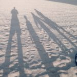 family shadows on beach