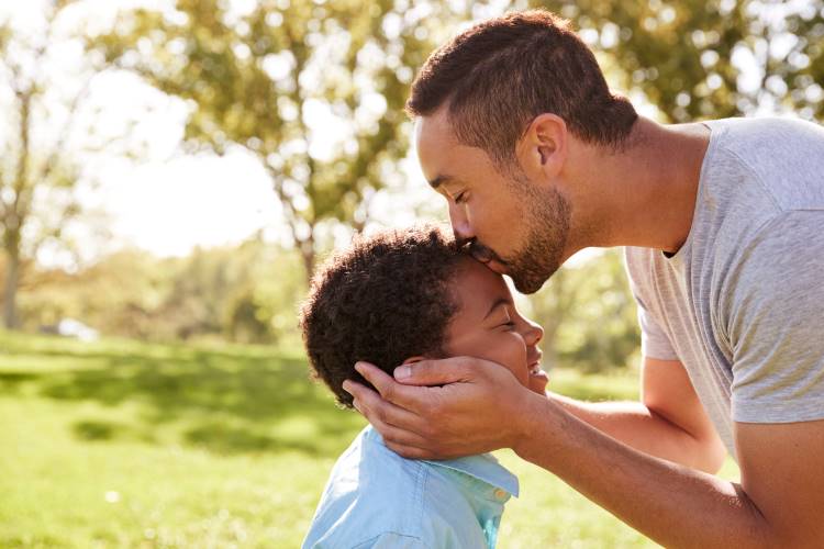father kisses son teach masculinity 1