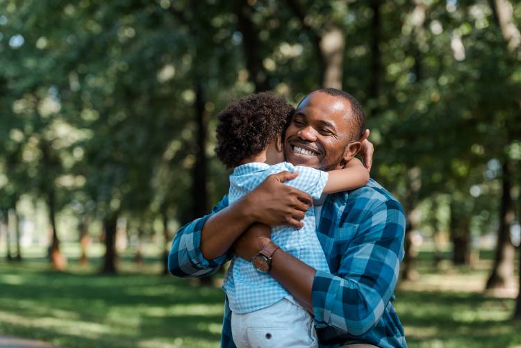 grace black father hugs son