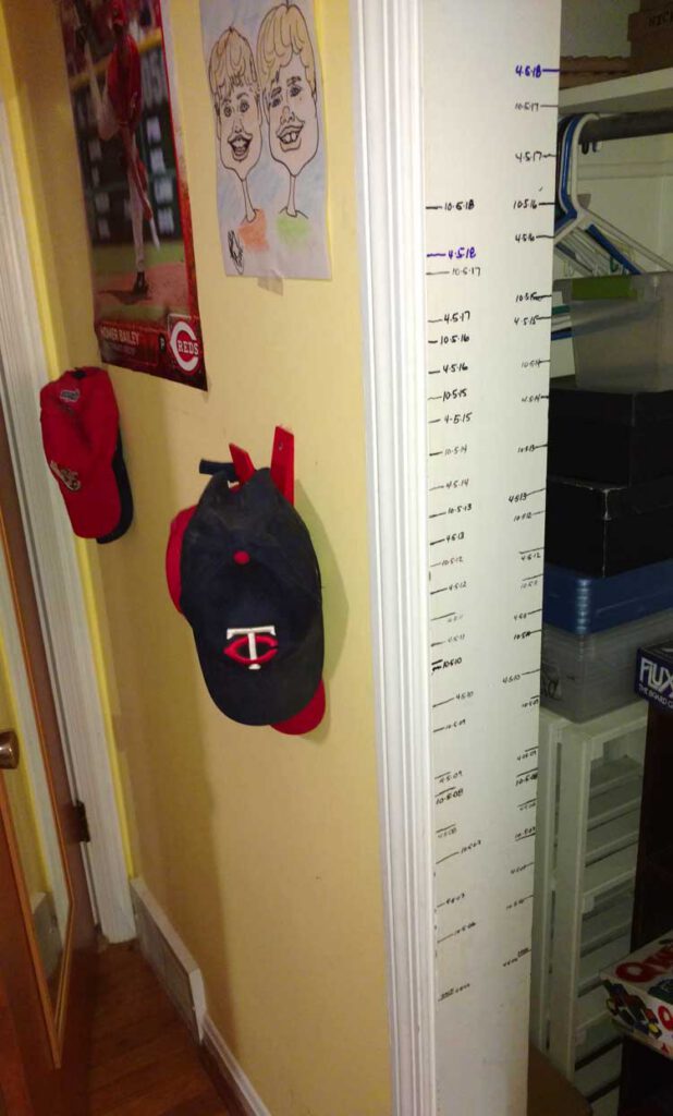 children's growth chart by marks on wall