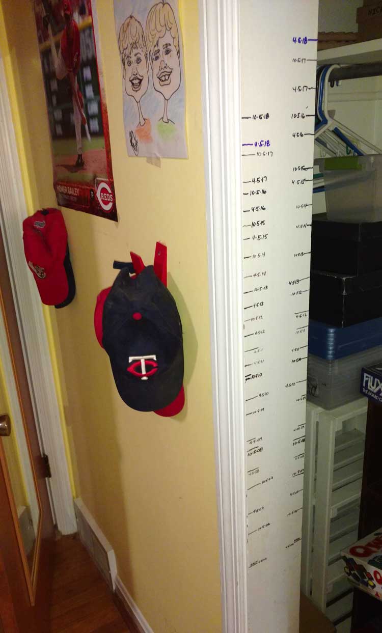 children's growth chart by marks on wall