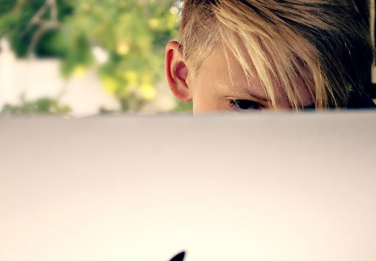 child at computer on social media