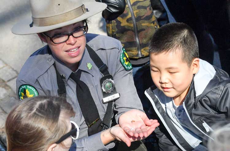 park ranger shows kids something cool