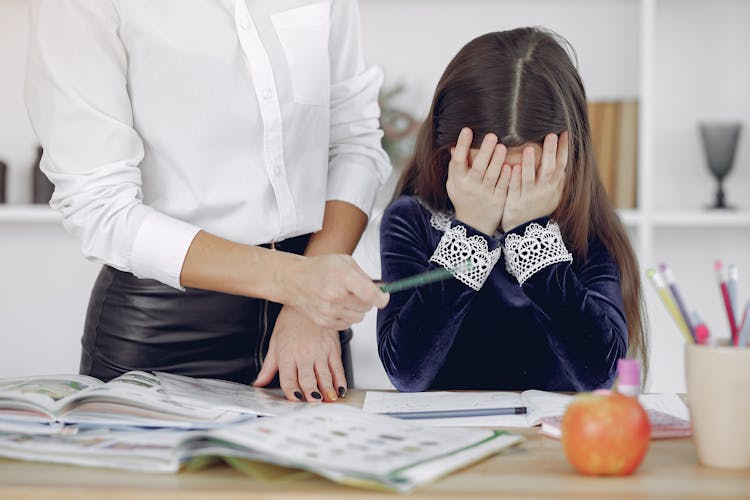 girl head in hands let kids fail failure mistake learn
