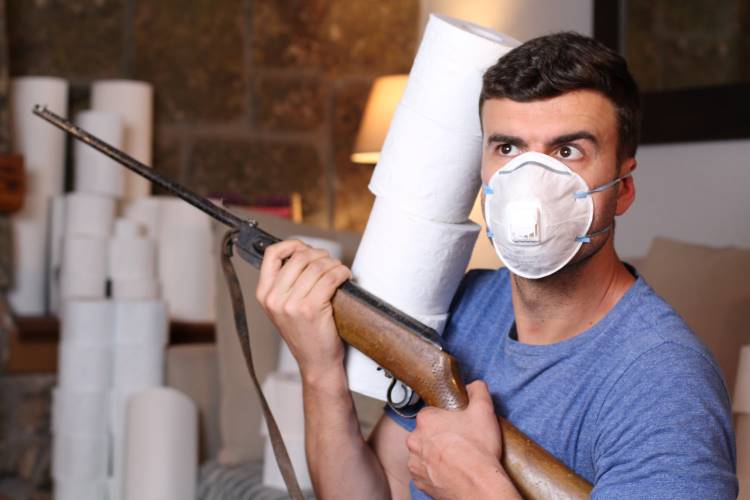 man gun holding toilet paper mask COVID 1