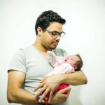 man holding baby