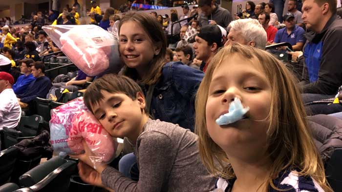 The three children of Indy Dads Group member Brian "Pete" Craig show their appreciation of the cotton candy dad bought for them at a recent NCAA March Madness game in Indianapolis. (Photo: Brian "Pete" Craig)