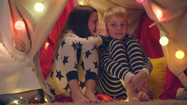 mixed gender sleepovers pajamas boy girl whisper 1