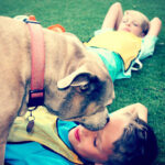 overscheduled children on sidelines with dog