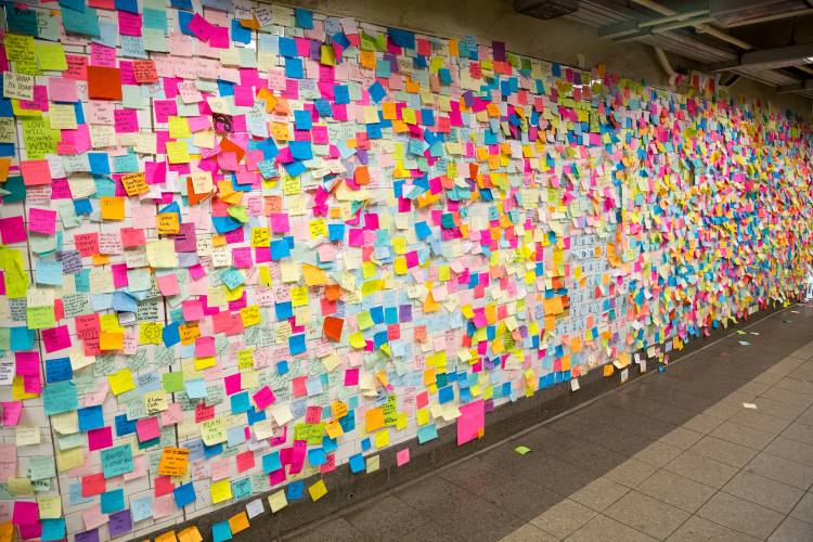 post-it notes on nyc subway wall