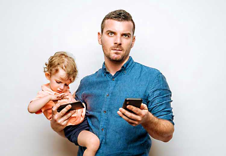 screened out movie dad holding son holding cell phones