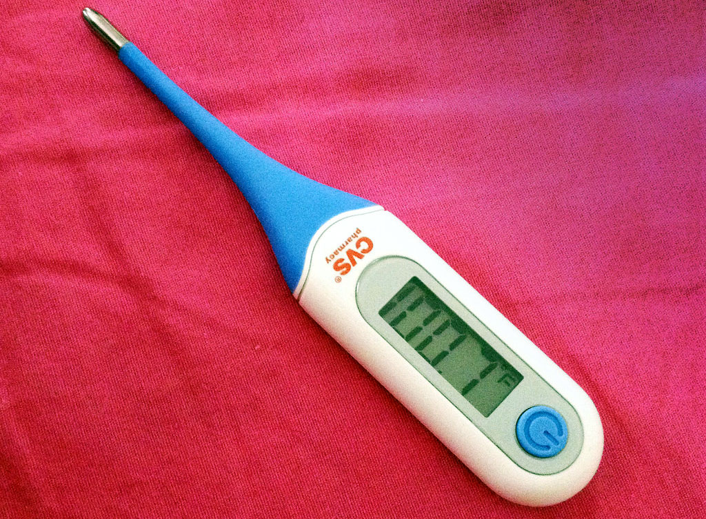 thermometer fever sick child