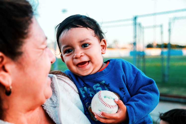 boy with baseball pro athletes and toddlers
