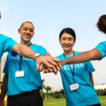 volunteer hands in together