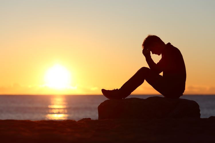 man worry sunset silhouette